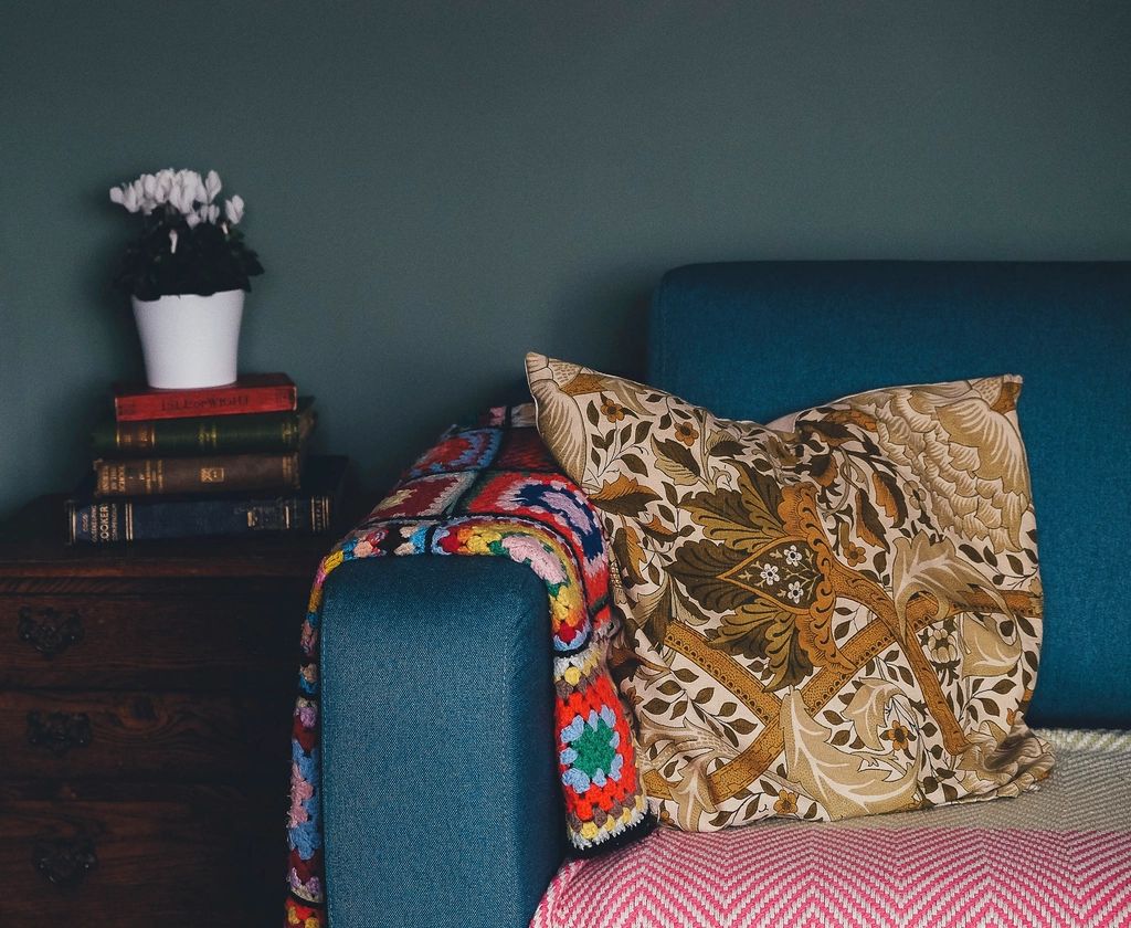 A suite sitting room with a sofa and armchairs